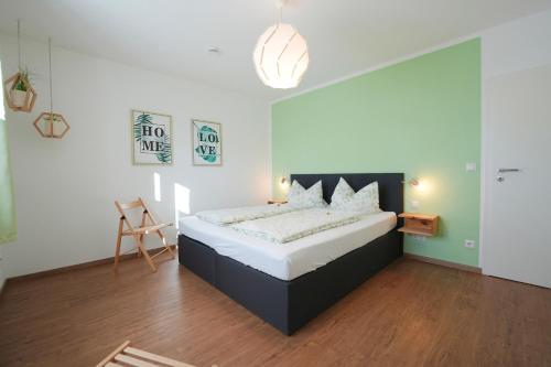 a bedroom with a bed in a room at Murg im Schwarzwaldhäusle in Freudenstadt