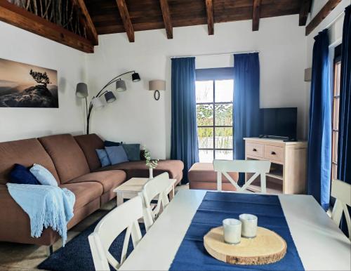 a living room with a couch and a table at Pension Kleiner König in Struppen-Siedlung