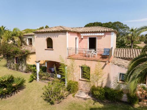 an aerial view of a house with a balcony at Classical Res Baia Delle Palme Prem Bilo 4 person in Santa Margherita di Pula