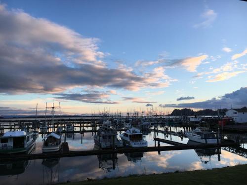 a group of boats docked in a marina at sunset at Salt Hotel & Pub in Ilwaco
