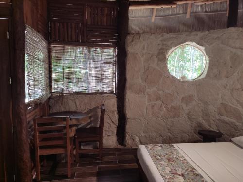Postel nebo postele na pokoji v ubytování Aldea Maya-Ha Cabañas con cenotes