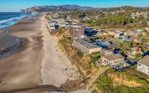 an aerial view of a beach with houses and the ocean at The Captains Place in Lincoln City