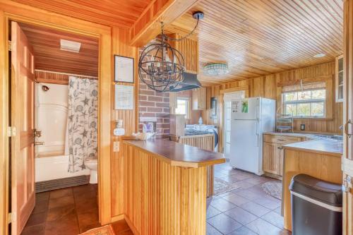a kitchen with a counter and a refrigerator at The Captains Place in Lincoln City