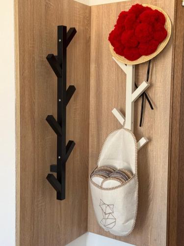 a room with a door with a basket of red roses at Wildneschd - Zentral & Schwarzwald Plus inklusive in Bad Wildbad