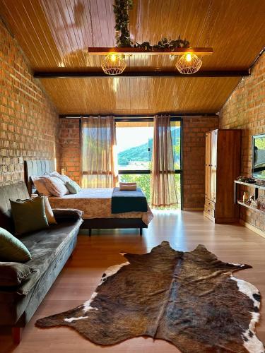 Ruang duduk di Pousada Refúgio das Águas Quarto 1