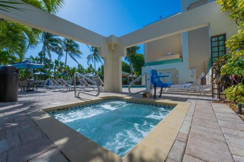 a swimming pool in the middle of a yard at Boca Plaza in Boca Raton