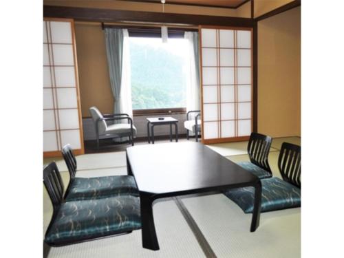 a dining room with a table and chairs at Hotel Tetora Resort Tateyama Kokusai - Vacation STAY 45318v in Tateyama