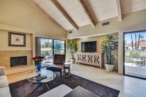 a living room with a couch and a fireplace at Elegant Lakeside Villa in Rancho Mirage