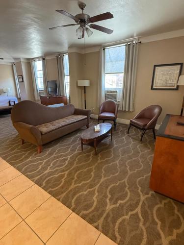 a living room with a couch and chairs at The Gadsden Hotel in Douglas