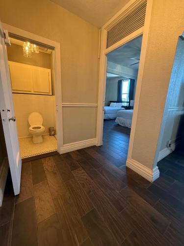 a hallway with a toilet in a room at The Gadsden Hotel in Douglas