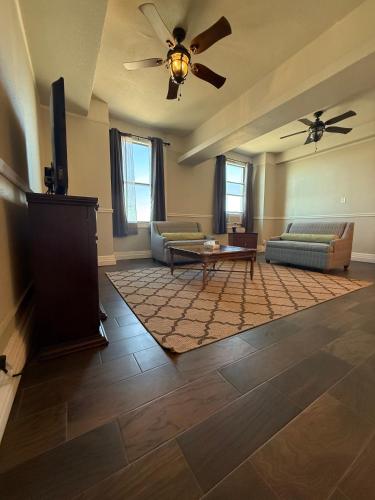a living room with two couches and a table at The Gadsden Hotel in Douglas