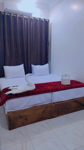 Postel nebo postele na pokoji v ubytování Sama Stars Hotel