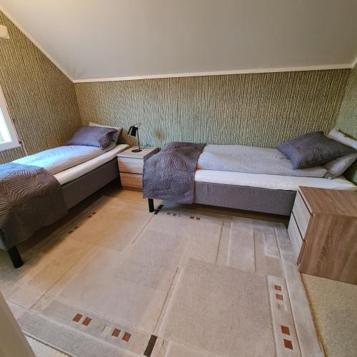 Postel nebo postele na pokoji v ubytování Skipperhuset