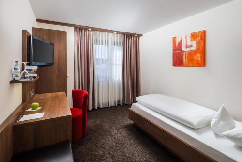 Ένα ή περισσότερα κρεβάτια σε δωμάτιο στο Hotel Schwanen