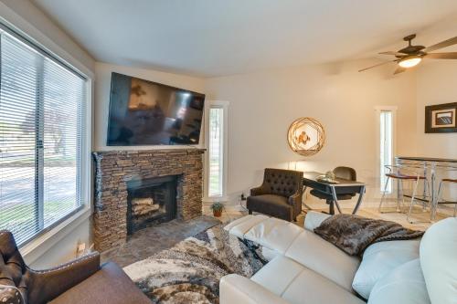 a living room with a white couch and a fireplace at Private Boise Couples Retreat WFH Friendly! in Boise