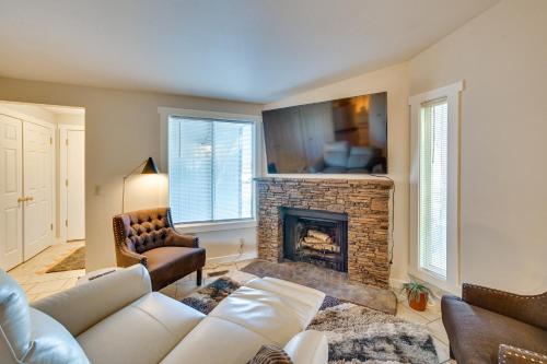 a living room with a couch and a fireplace at Private Boise Couples Retreat WFH Friendly! in Boise