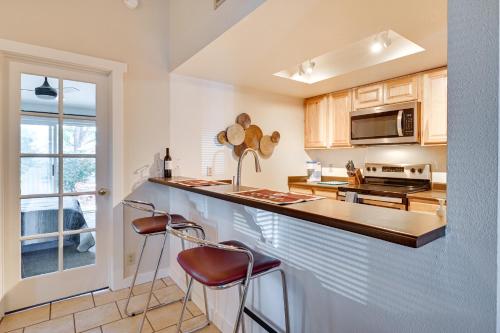a kitchen with a counter and two bar stools at Private Boise Couples Retreat WFH Friendly! in Boise