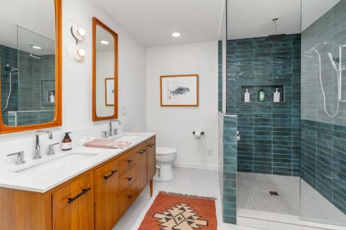 a bathroom with a sink and a shower at How you Dune in Saugatuck