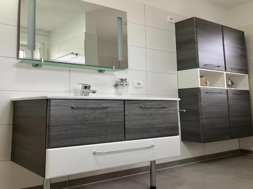 a bathroom with a sink and a mirror at Ferienwohnung in Mirow for 4 Personen in Mirow
