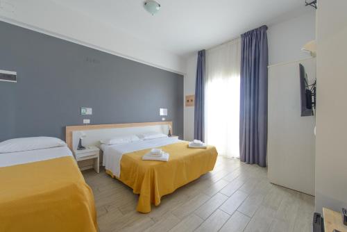 Katil atau katil-katil dalam bilik di Nautic Beach Hotel