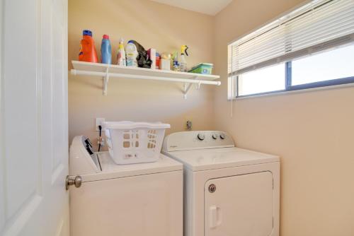 a small laundry room with a washer and dryer at Walk to Bradenton Beach Gulf-View Home with Lanai in Bradenton Beach