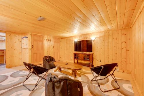 a wooden room with a wooden table and chairs at 2 Mi to CU Boulder Townhome with Private Deck! in Boulder