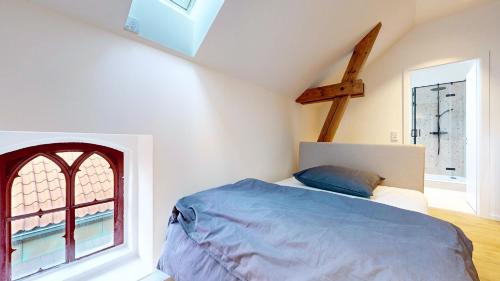 a bedroom with a bed and a window at Apt 11 No 8A BoardingHouse Lüneburg in Lüneburg