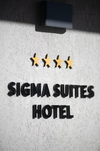 a sign for a hotel with four gold stars at SIGMA Suites Hotel in Thessaloniki
