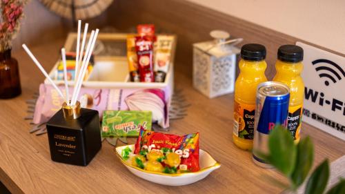 a table with a bowl of food and drinks on it at SM Exclusive Apartments in Visoko