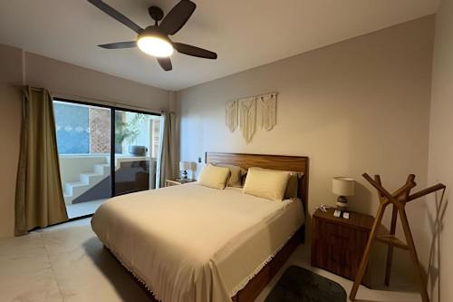 Ένα ή περισσότερα κρεβάτια σε δωμάτιο στο Condominio Casa Laúd