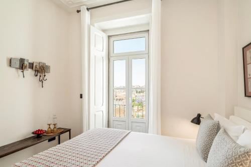Postel nebo postele na pokoji v ubytování Casa das Janelas com Vista
