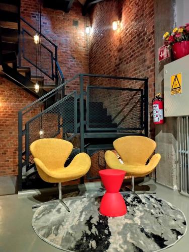 Uma área de estar em Hotel NEXT