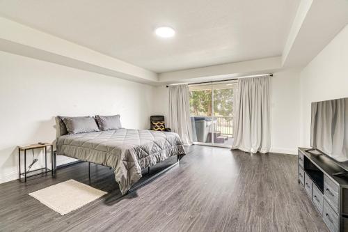 a bedroom with a bed and a flat screen tv at Private Hot Tub and Golf Course Views Lakeway Gem in Lakeway