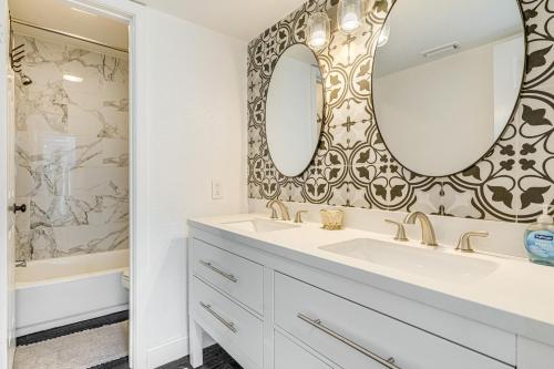 a bathroom with a sink and a mirror at Private Hot Tub and Golf Course Views Lakeway Gem in Lakeway