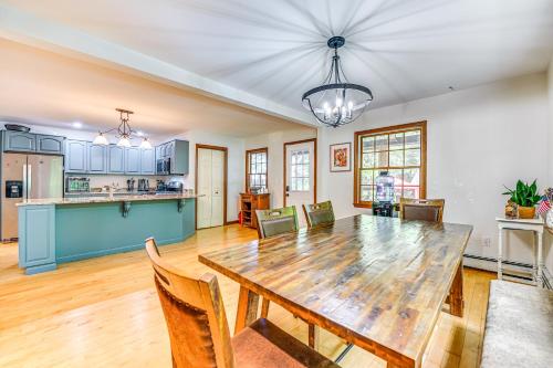 a kitchen and dining room with a wooden table and chairs at Charming Ballston Spa Home with Sauna and Private Pool in Ballston Spa