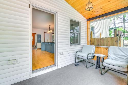 a porch with a chair and a table at Charming Ballston Spa Home with Sauna and Private Pool in Ballston Spa