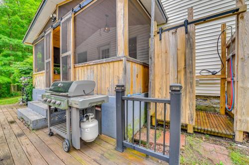 a grill sitting on a deck next to a house at Charming Ballston Spa Home with Sauna and Private Pool in Ballston Spa