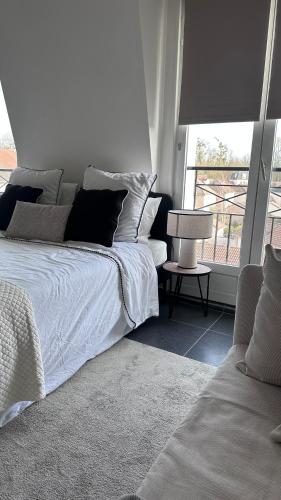 Una cama o camas en una habitación de Appartement Cosy - Proche Roissy, Disney et Gare pour Paris
