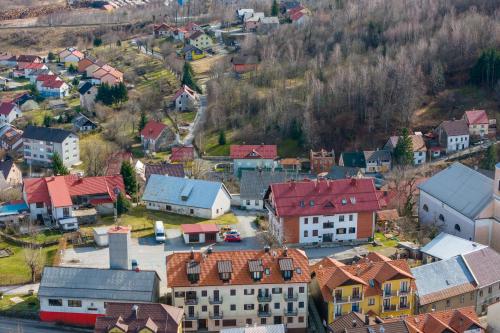an aerial view of a small town with houses at Apartments Sofija in Fužine