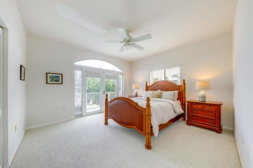 a bedroom with a bed and a ceiling fan at Half-Mi to Boat Ramp Canal-Front Florida Keys Gem in Tavernier