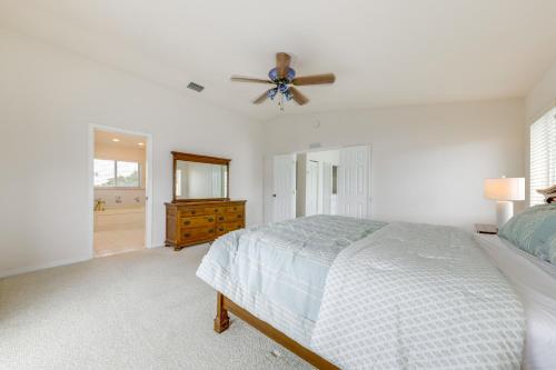 a bedroom with a bed and a ceiling fan at Half-Mi to Boat Ramp Canal-Front Florida Keys Gem in Tavernier