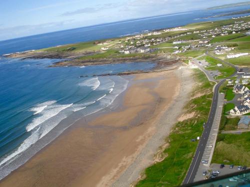 an aerial view of a beach and the ocean at Barkers Accommodation in Spanish Point