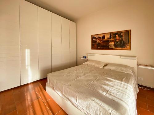 A bed or beds in a room at Residence Kormorano