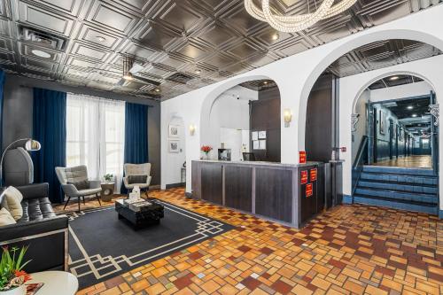 a living room with a lobby with a staircase at Nine20 Collins Apartments by Lowkl in Miami Beach