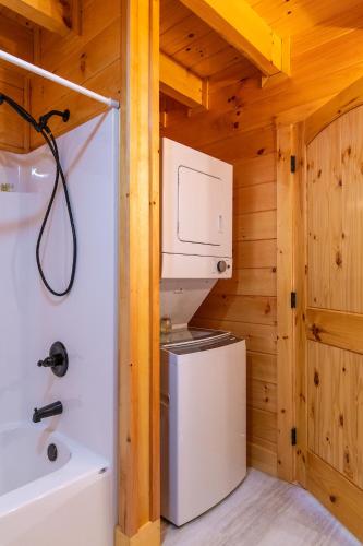 a small kitchen with a refrigerator and a microwave at Cozy Canopy in Stanton