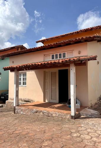 a house with a front porch with a garage at JGM chalés in Barreirinhas