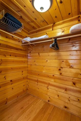 a log cabin with a wooden wall at Mill Creek Point in Rogers