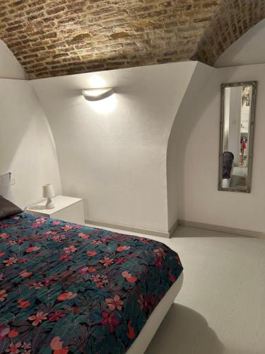Ένα ή περισσότερα κρεβάτια σε δωμάτιο στο La Vista sul Castello House