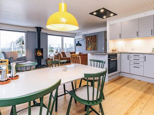 a kitchen and living room with a table and chairs at 6 person holiday home in Karrebæksminde-By Traum in Karrebæksminde