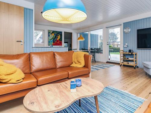 a living room with a couch and a table at 6 person holiday home in Karrebæksminde-By Traum in Karrebæksminde